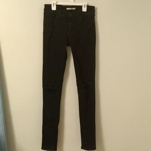 Black Levi's ripped jeans